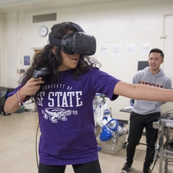 A student playing a Virtual Reality game