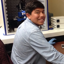 A students works on the atomic force microscope