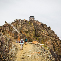 Two people hiking in the Sierra Nevada hills